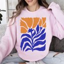 Large Light Pink Floral Design Featuring Bold Blues And Oranges Flowers And Nature Motif Sweatshirt