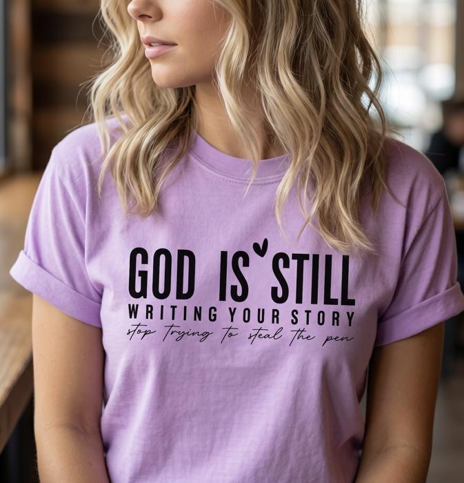 God Is Still Writing Your Story Graphic Tee, Christian Shirt for Women, Faith Based Tee, Inspirational Religious Gift for Her, Comfort Colors Bible Verse Tee