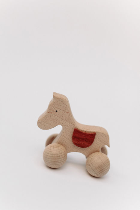 Wooden toy on wheels